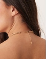Curve multirow necklace with long tassel detail in gold tone