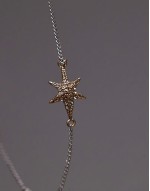 star pendent bracelet in gold